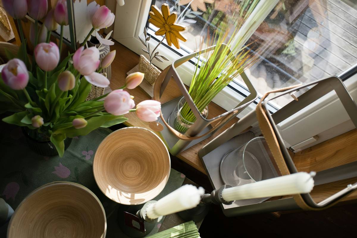 Handmade easter centerpiece with natural twigs, linen napkins, and dyed eggs showcasing decorating for easter ideas